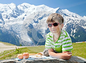 The boy has got pic nic on top of mountain photo