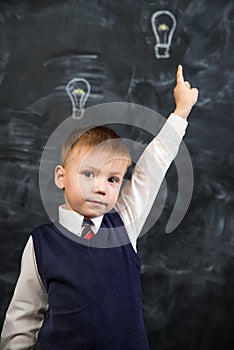 The boy has an idea drawn on the Board light bulb