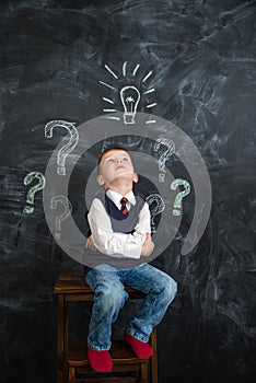 The boy has an idea drawn on the Board light bulb