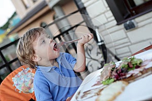 Boy has salad