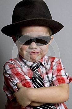 The boy in a hat and black glasses