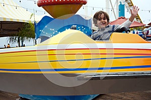 Boy having fun at an amusement park