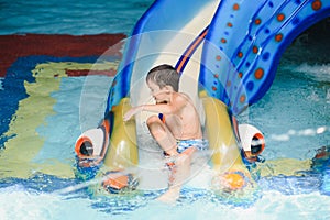 Boy having fun in aqua park