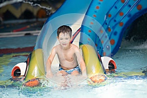 Boy having fun in aqua park