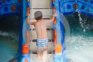 Boy having fun in aqua park