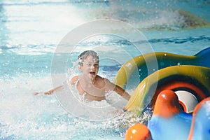 Boy having fun in aqua park