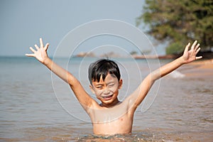 Boy having fun in the sea.