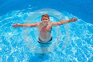 Boy in having fun in the swimming pool