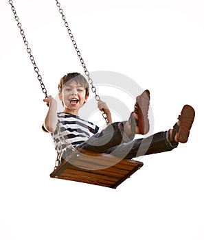 Boy having fun on a swing.