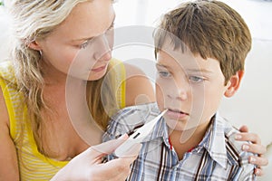 Boy Having His Temperature Measured