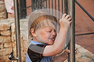 Boy is having a shower