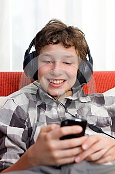 Boy with Headphones Listening to mp3 player