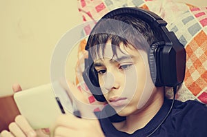 Boy with headphones and smart phone