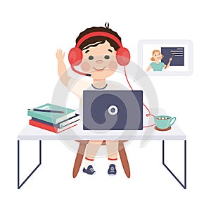 Boy in Headphones Studying Online Using Computer and Raising His Hand to Answer, Distance Lesson, Homeschooling Concept