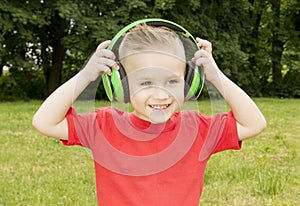 Boy in headphones summer smiling