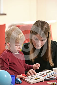 A Boy With A Hearing Aids And Cochlear Implants