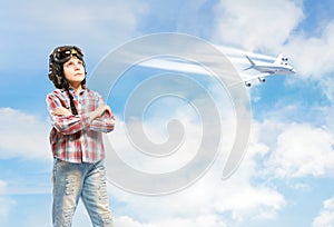 Boy in helmet pilot dreaming of becoming a pilot