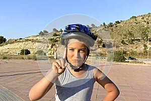 Boy with helmet riding MonoWheel on promenade photo