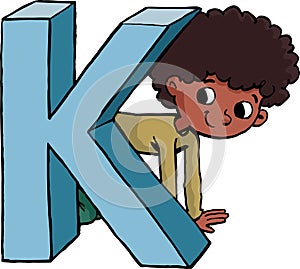 boy is hiding behind the capital letter K