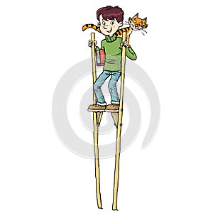 Boy on high stilts with a cat on his shoulder