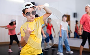 Boy hip-hop dancer posing at studio