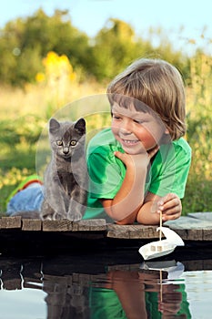 Boy and his beloved kitten photo