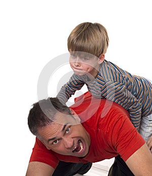 A boy on his fathers back, parenting can be diffic
