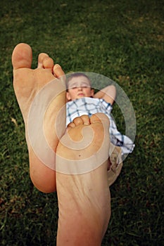 Boy with his feet together in the air photo