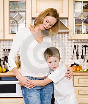 Boy with his pregnant mother