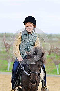 Boy and his Shetland pony