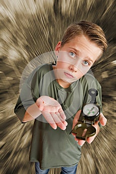 Boy hold a compass on monochrome background