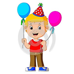 Boy holding balloons