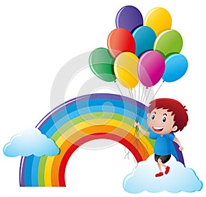 Boy holding balloons with rainbow background