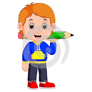 Boy holding big pencil