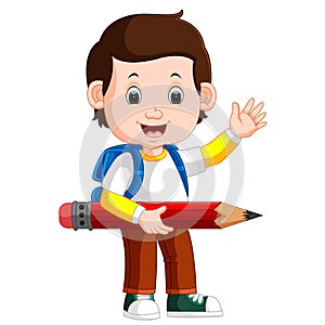 Boy holding big pencil