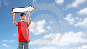 Boy holding big white rightwards thick arrow