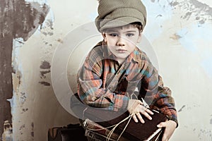 Boy holding books, retro stylized shot, 50s-60s