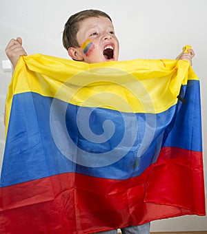 Boy holding an Colombian flag