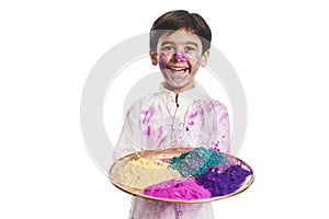 Boy holding color plate