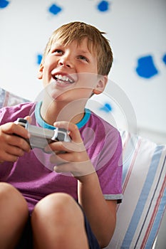 Boy Holding Controller Playing Video Game