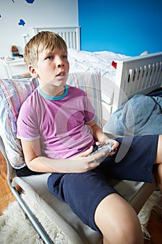 Boy Holding Controller Playing Video Game