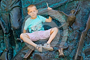 Boy holding a dove in his hands