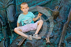 Boy holding a dove in his hands