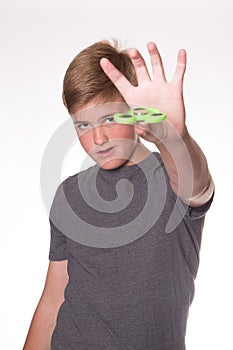 Boy holding fidget spinner