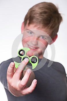 Boy holding fidget spinner