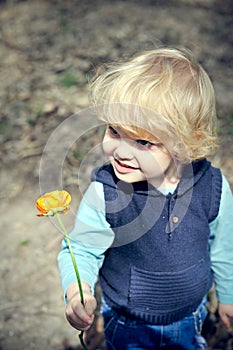 Boy holding a flower