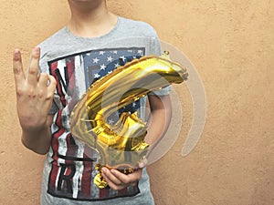 Boy holding four golden number for Independence Day