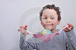 Boy holding a globe stock photo