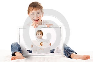 Boy holding his baby photos