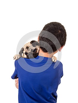 A boy holding his dog